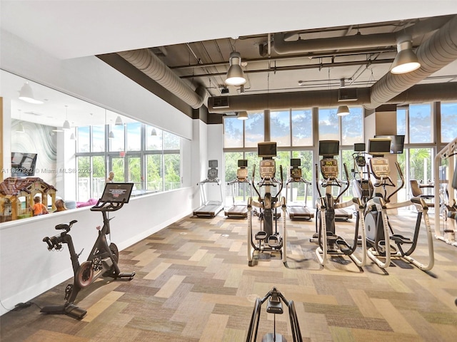 16385 Biscayne Blvd Unit 403, North Miami Beach, FL 33160 - exercise room featuring carpet flooring and plenty of natural light