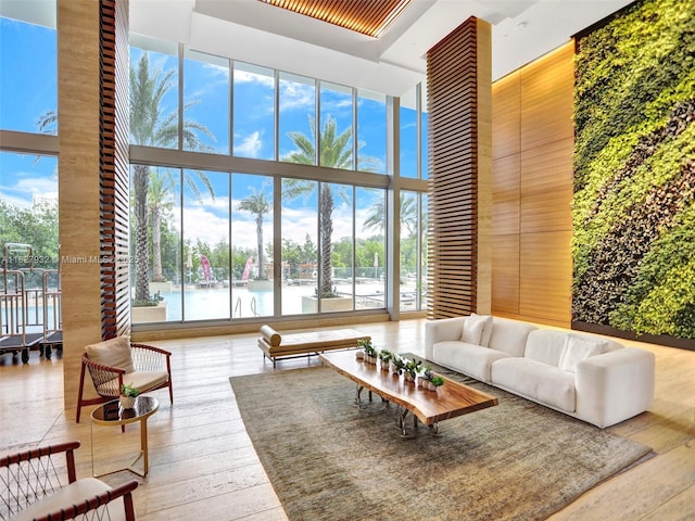 16385 Biscayne Blvd Unit 403, North Miami Beach, FL 33160 - lobby featuring a towering ceiling, a wall of windows, a water view, and wooden walls