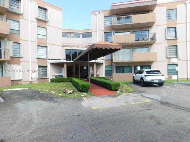 5900 SW 127th Ave Unit 3304, Miami, FL 33183 - view of apartment building / complex featuring uncovered parking