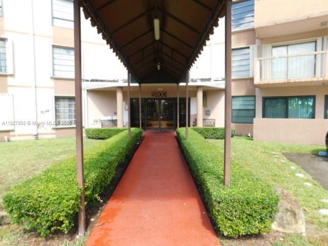 5900 SW 127th Ave Unit 3304, Miami, FL 33183 - view of exterior entry with french doors and stucco siding
