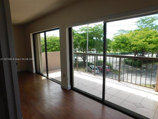5900 SW 127th Ave Unit 3304, Miami, FL 33183 - doorway to outside featuring wood finished floors