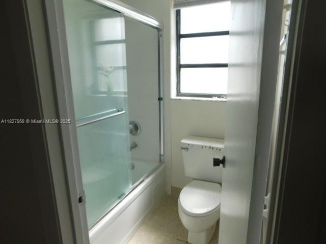 5900 SW 127th Ave Unit 3304, Miami, FL 33183 - full bath with enclosed tub / shower combo and tile patterned flooring