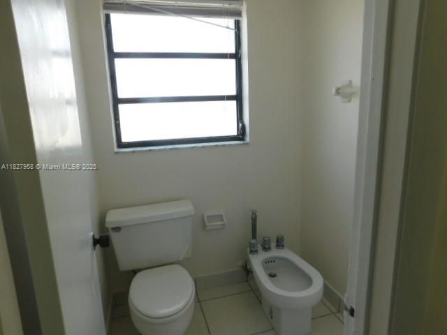5900 SW 127th Ave Unit 3304, Miami, FL 33183 - bathroom with a bidet and tile patterned floors
