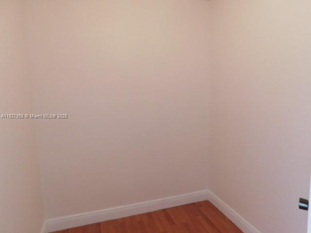 5900 SW 127th Ave Unit 3304, Miami, FL 33183 - spare room featuring baseboards and light wood-style floors