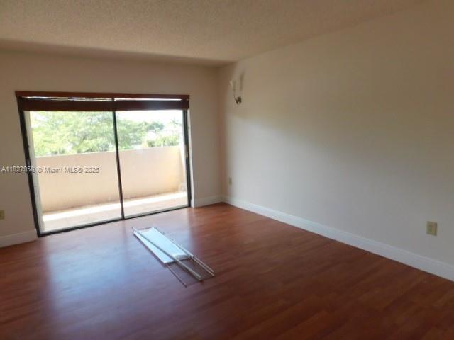 5900 SW 127th Ave Unit 3304, Miami, FL 33183 - empty room featuring wood finished floors and baseboards