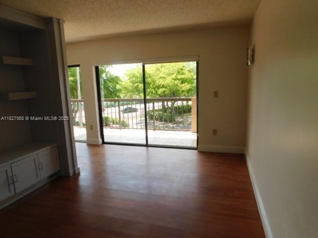 5900 SW 127th Ave Unit 3304, Miami, FL 33183 - spare room featuring wood finished floors and a textured ceiling
