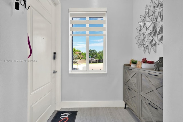17709 SW 150th Ct, Miami, FL 33187 - entryway featuring baseboards and light wood finished floors