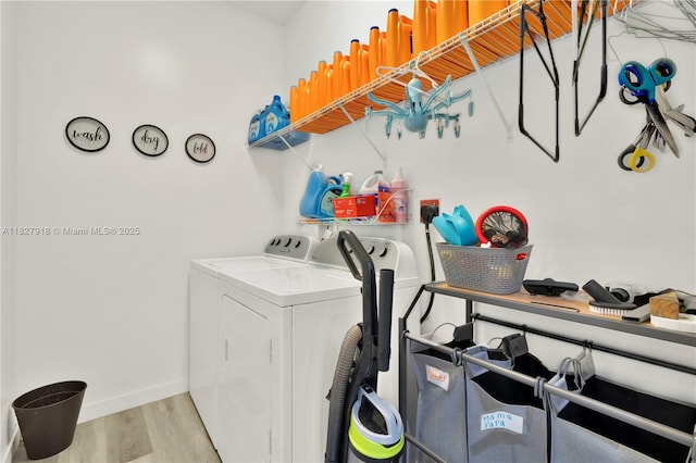 17709 SW 150th Ct, Miami, FL 33187 - laundry area with washing machine and clothes dryer and wood finished floors