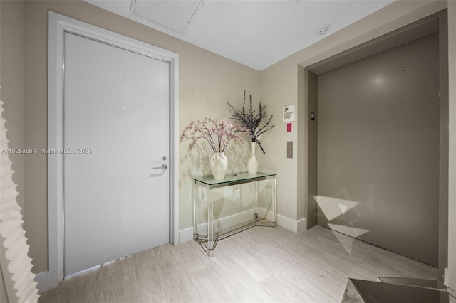 460 NE 28th St Unit 2407, Miami, FL 33137 - corridor with elevator and wood finished floors