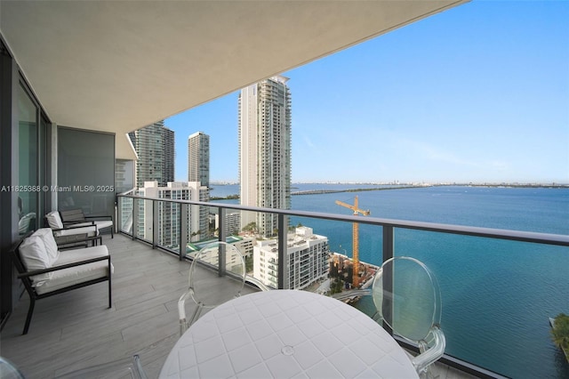 460 NE 28th St Unit 2407, Miami, FL 33137 - balcony featuring a water view and outdoor dining space