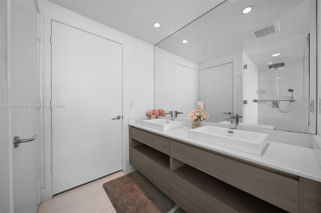 460 NE 28th St Unit 2407, Miami, FL 33137 - full bathroom featuring double vanity, a stall shower, tile patterned flooring, and recessed lighting