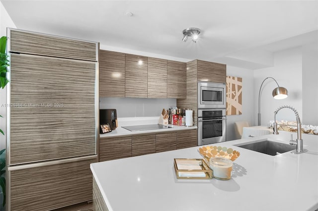 460 NE 28th St Unit 2407, Miami, FL 33137 - kitchen with stainless steel appliances, brown cabinetry, light countertops, and modern cabinets