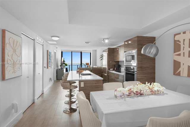 460 NE 28th St Unit 2407, Miami, FL 33137 - dining space with light wood finished floors and baseboards