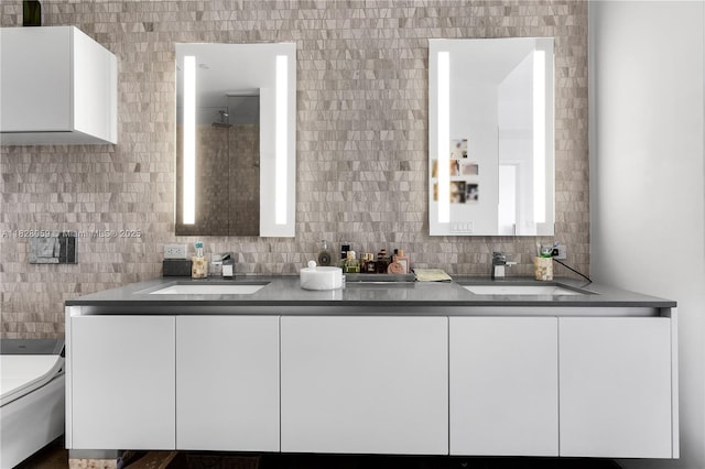 88 SW 7th St Unit 1008, Miami, FL 33130 - bathroom with double vanity, tasteful backsplash, and tile walls