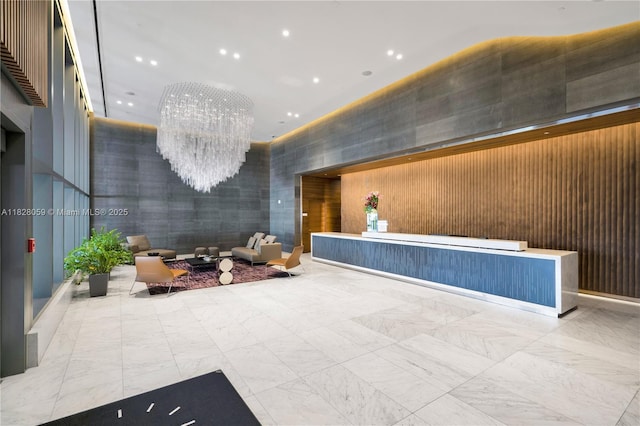 88 SW 7th St Unit 1008, Miami, FL 33130 - reception area with a chandelier, a towering ceiling, and recessed lighting