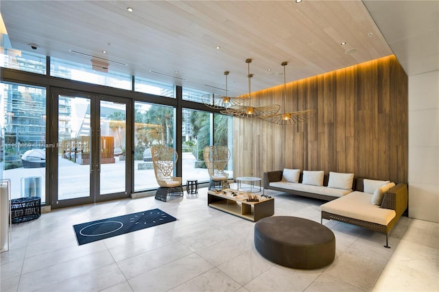 88 SW 7th St Unit 1008, Miami, FL 33130 - building lobby featuring a wall of windows, wood walls, and wooden ceiling