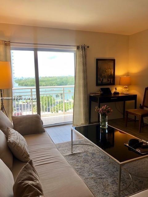 400 Kings Point Dr Unit 820, Sunny Isles Beach, FL 33160 - living area with wood finished floors