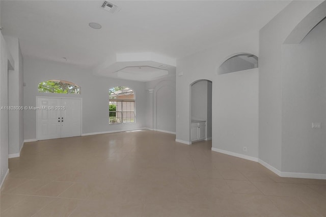 3843 Oak Ridge Cir, Weston, FL 33331 - spare room with light tile patterned floors and arched walkways