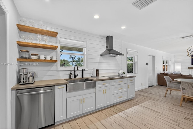 228 Rutland Blvd, West Palm Beach, FL 33405 - kitchen with dishwasher, wall chimney range hood, healthy amount of natural light, open floor plan, and recessed lighting