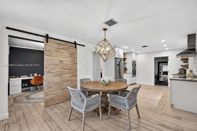228 Rutland Blvd, West Palm Beach, FL 33405 - dining area with light wood-style flooring, a barn door, an office area, a chandelier, and recessed lighting