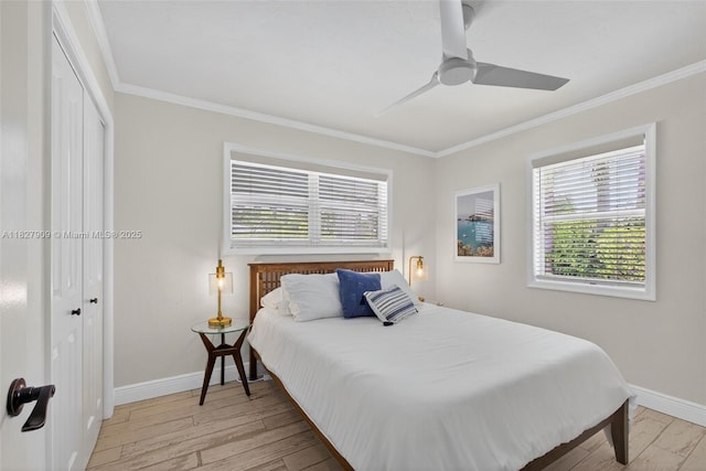 228 Rutland Blvd, West Palm Beach, FL 33405 - bedroom featuring crown molding, multiple windows, light wood-type flooring, a closet, and ceiling fan