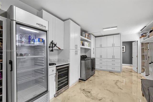 228 Rutland Blvd, West Palm Beach, FL 33405 - kitchen with beverage cooler, open shelves, and white cabinetry
