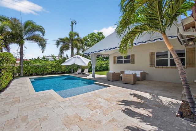 228 Rutland Blvd, West Palm Beach, FL 33405 - view of swimming pool featuring a patio area and an outdoor living space