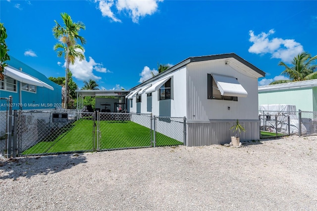 456 Bowie Ln, Key Largo, FL 33037 - view of home's exterior featuring a gate