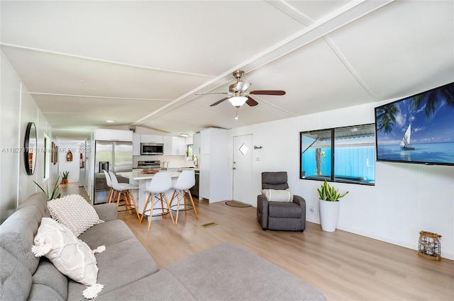 456 Bowie Ln, Key Largo, FL 33037 - living room featuring light wood-style floors and a ceiling fan