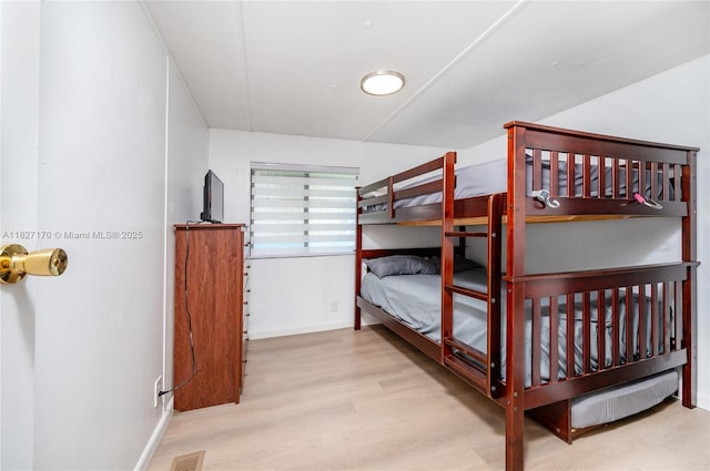 456 Bowie Ln, Key Largo, FL 33037 - bedroom with wood finished floors and baseboards