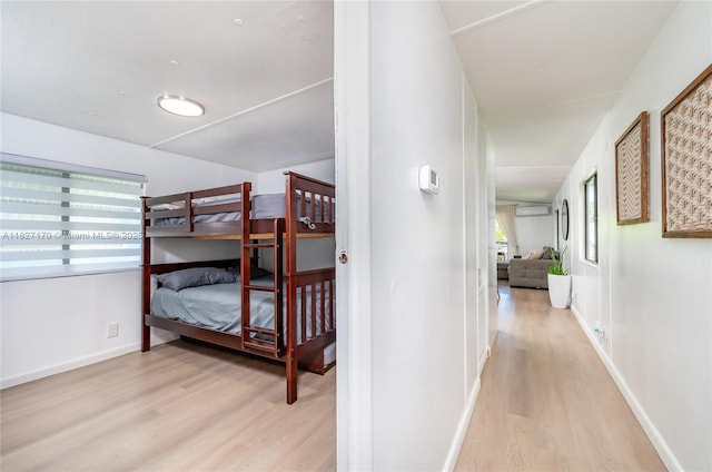 456 Bowie Ln, Key Largo, FL 33037 - corridor with light wood-style floors and a wall mounted air conditioner