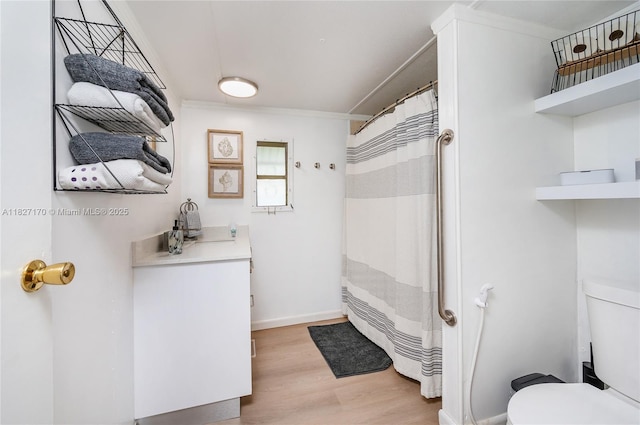 456 Bowie Ln, Key Largo, FL 33037 - bathroom featuring wood finished floors, vanity, and a shower with shower curtain