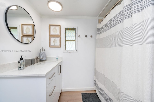 456 Bowie Ln, Key Largo, FL 33037 - full bathroom with ornamental molding, vanity, and wood finished floors