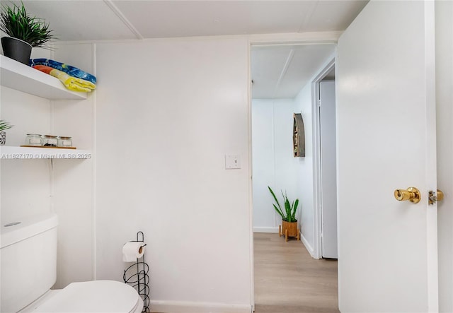456 Bowie Ln, Key Largo, FL 33037 - half bathroom with toilet and wood finished floors