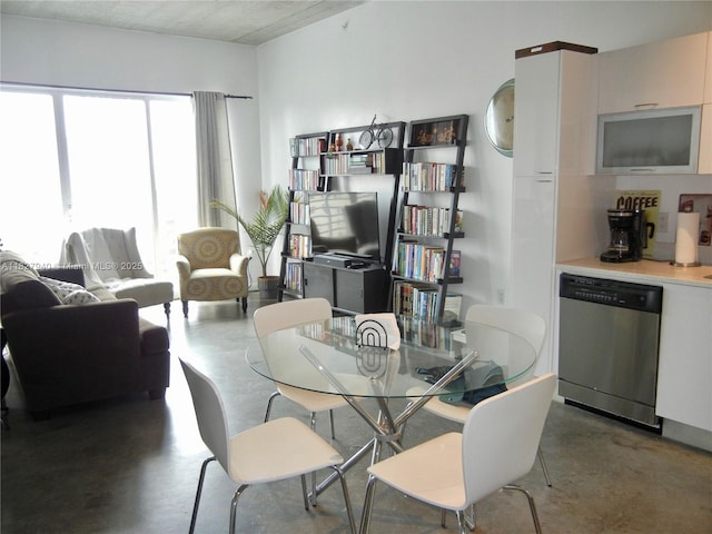 133 NE 2nd Ave Unit 815, Miami, FL 33132 - dining area with concrete floors