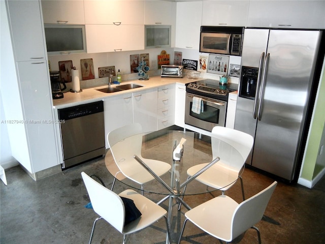 133 NE 2nd Ave Unit 815, Miami, FL 33132 - kitchen with appliances with stainless steel finishes, white cabinets, and light countertops