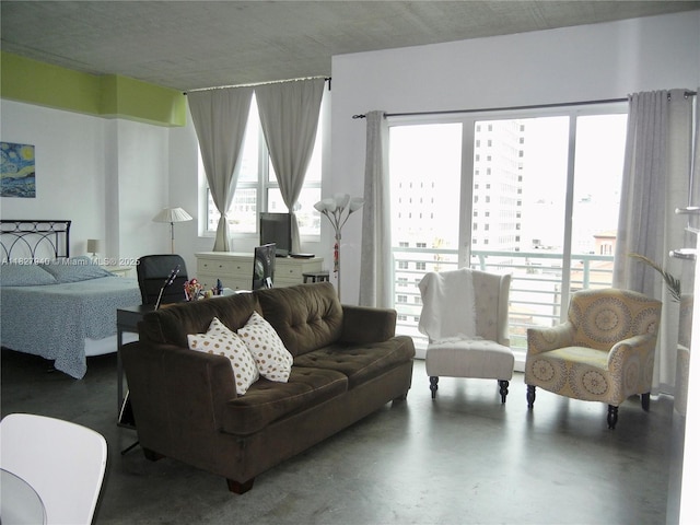 133 NE 2nd Ave Unit 815, Miami, FL 33132 - living area featuring finished concrete flooring