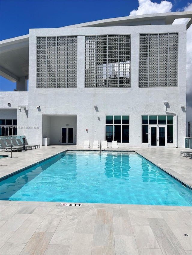 133 NE 2nd Ave Unit 815, Miami, FL 33132 - community pool featuring french doors and a patio area
