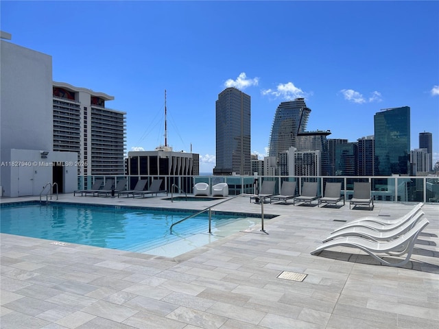 133 NE 2nd Ave Unit 815, Miami, FL 33132 - community pool featuring a patio area and a skyline view