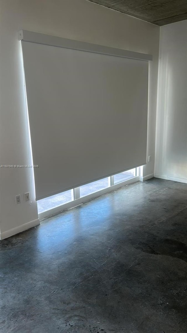133 NE 2nd Ave Unit 815, Miami, FL 33132 - unfurnished room with concrete floors and healthy amount of natural light