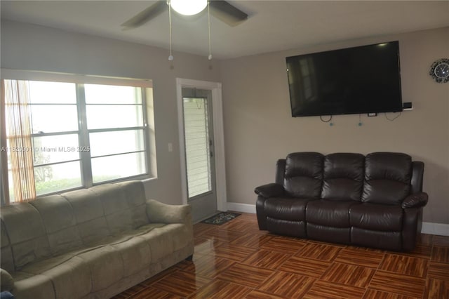 56 Norwich C Unit 56, West Palm Beach, FL 33417 - living area with ceiling fan and baseboards