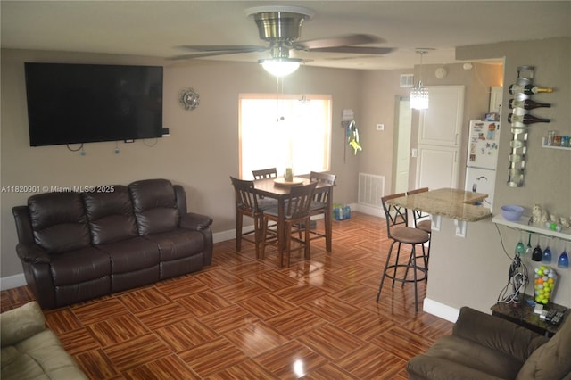 56 Norwich C Unit 56, West Palm Beach, FL 33417 - living room featuring ceiling fan and baseboards