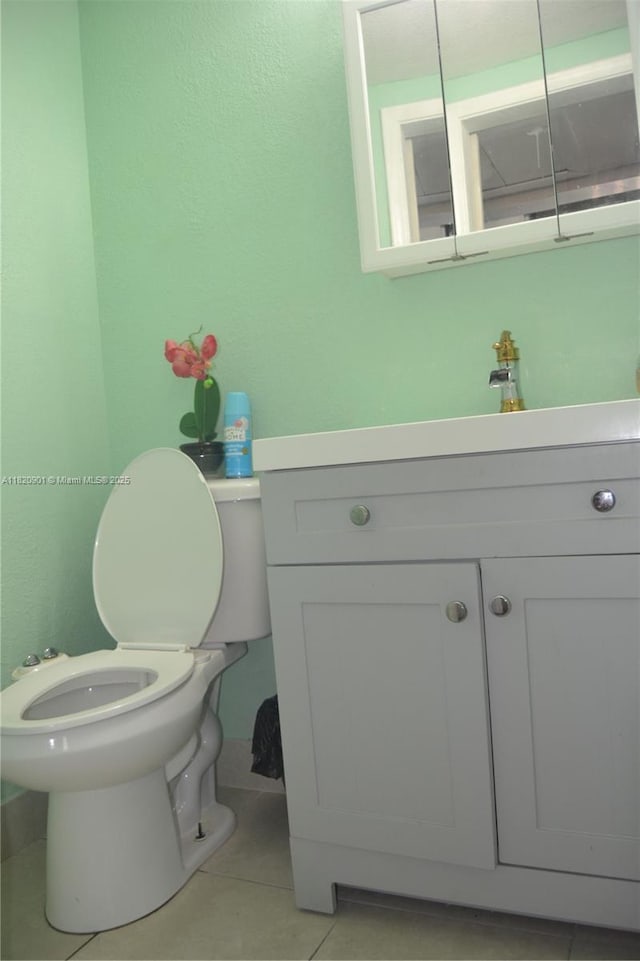 56 Norwich C Unit 56, West Palm Beach, FL 33417 - half bathroom featuring vanity, tile patterned floors, and a bidet