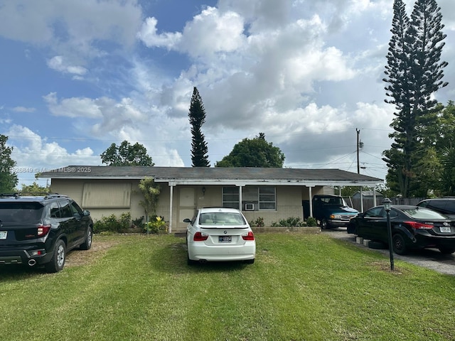 506 York Rd, Lehigh Acres, FL 33936 - ranch-style home with a front lawn and an attached carport