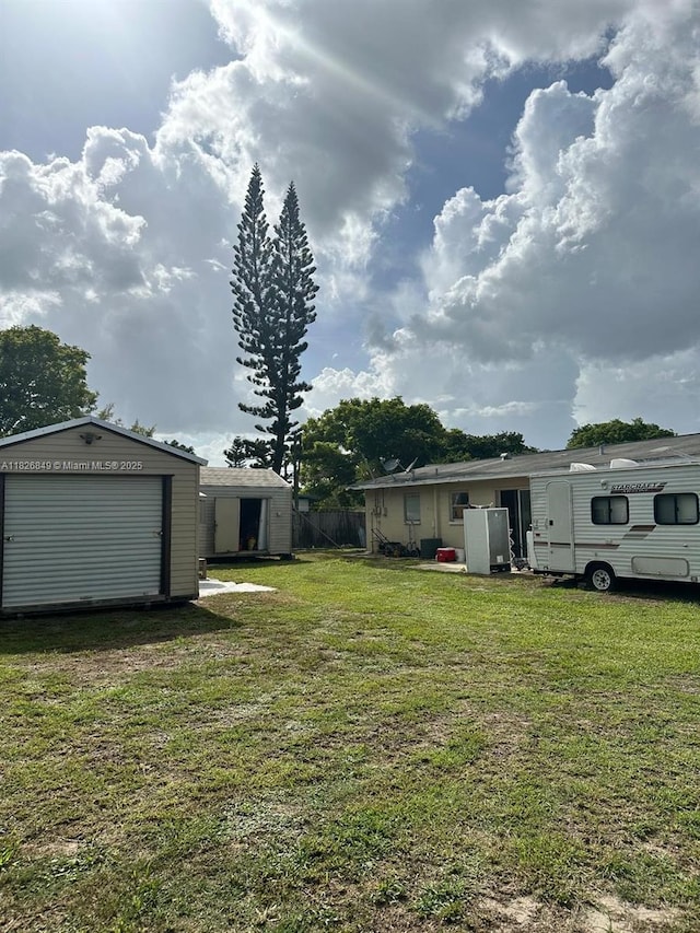 506 York Rd, Lehigh Acres, FL 33936 - view of yard featuring a shed