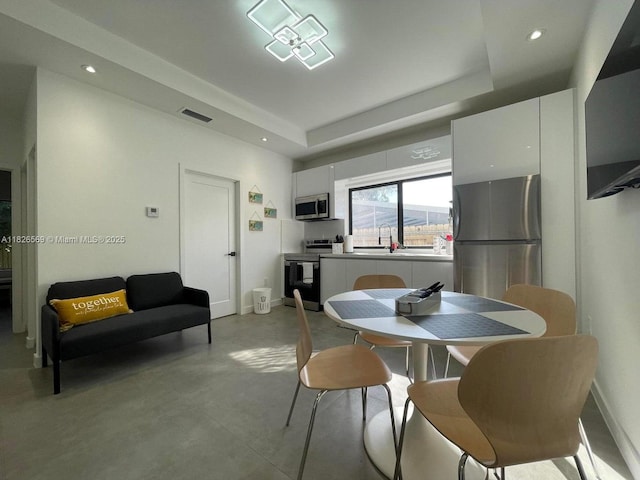 901 Estall St, Key Largo, FL 33037 - dining room featuring finished concrete floors, recessed lighting, and a raised ceiling