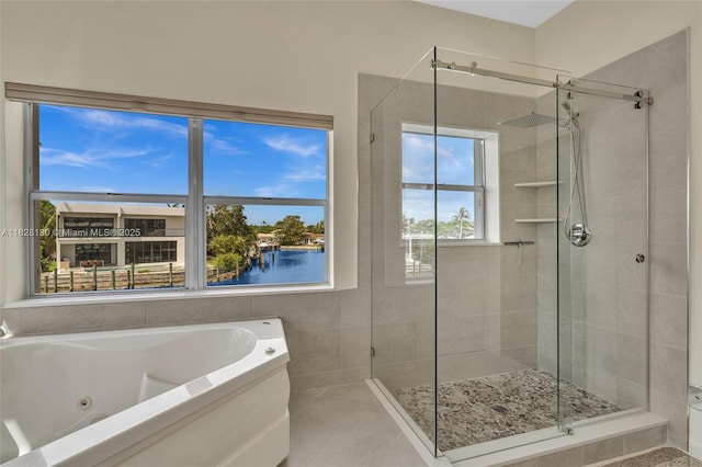 2108 NE 24th St, Wilton Manors, FL 33305 - full bath featuring a stall shower, a tub with jets, a water view, and tile patterned floors