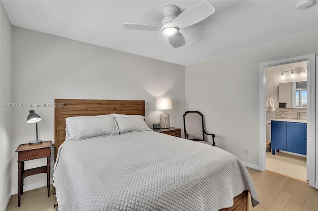 2108 NE 24th St, Wilton Manors, FL 33305 - bedroom featuring light wood-type flooring, a ceiling fan, and ensuite bath