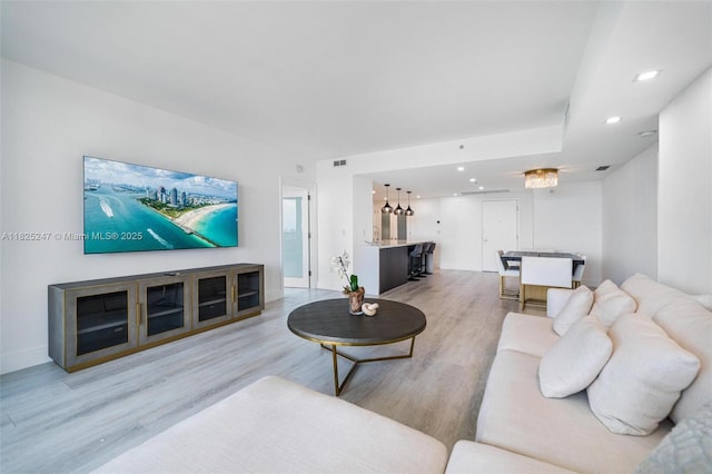 3400 SW 27th Ave Unit 1605, Miami, FL 33133 - living area with wood finished floors, bar, and recessed lighting