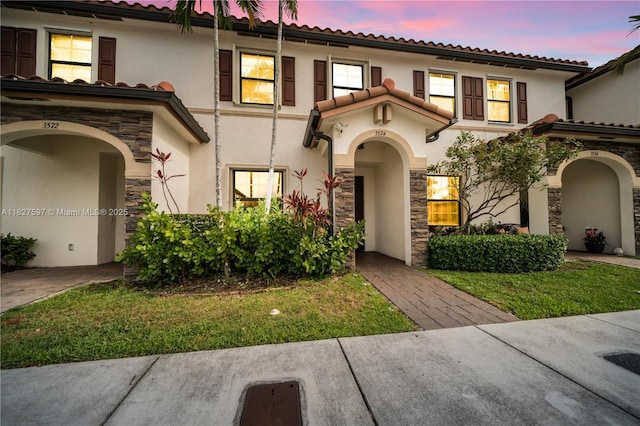 3574 W 88th Ter, Hialeah, FL 33018 - view of front of property with stone siding, stucco siding, and a tile roof